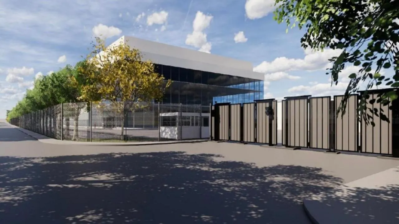 Render do data center de IA planejado pela Nscale em Loughton, prédio de vidro com telhado branco cercado por árvores